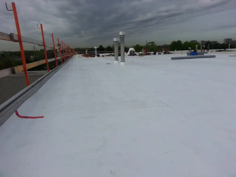 A white roof with pipes and a fire hydrant