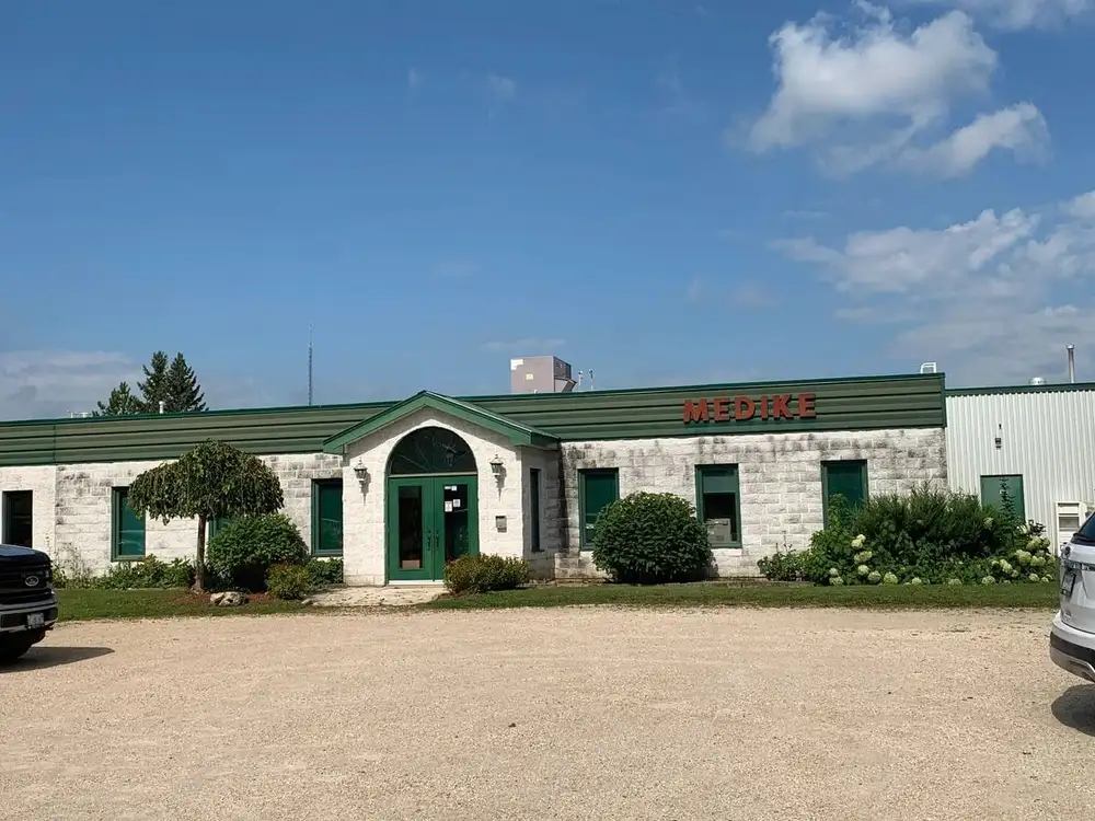 A building with green trim and white walls.